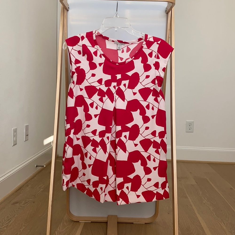 Red and white print sleeveless blouse